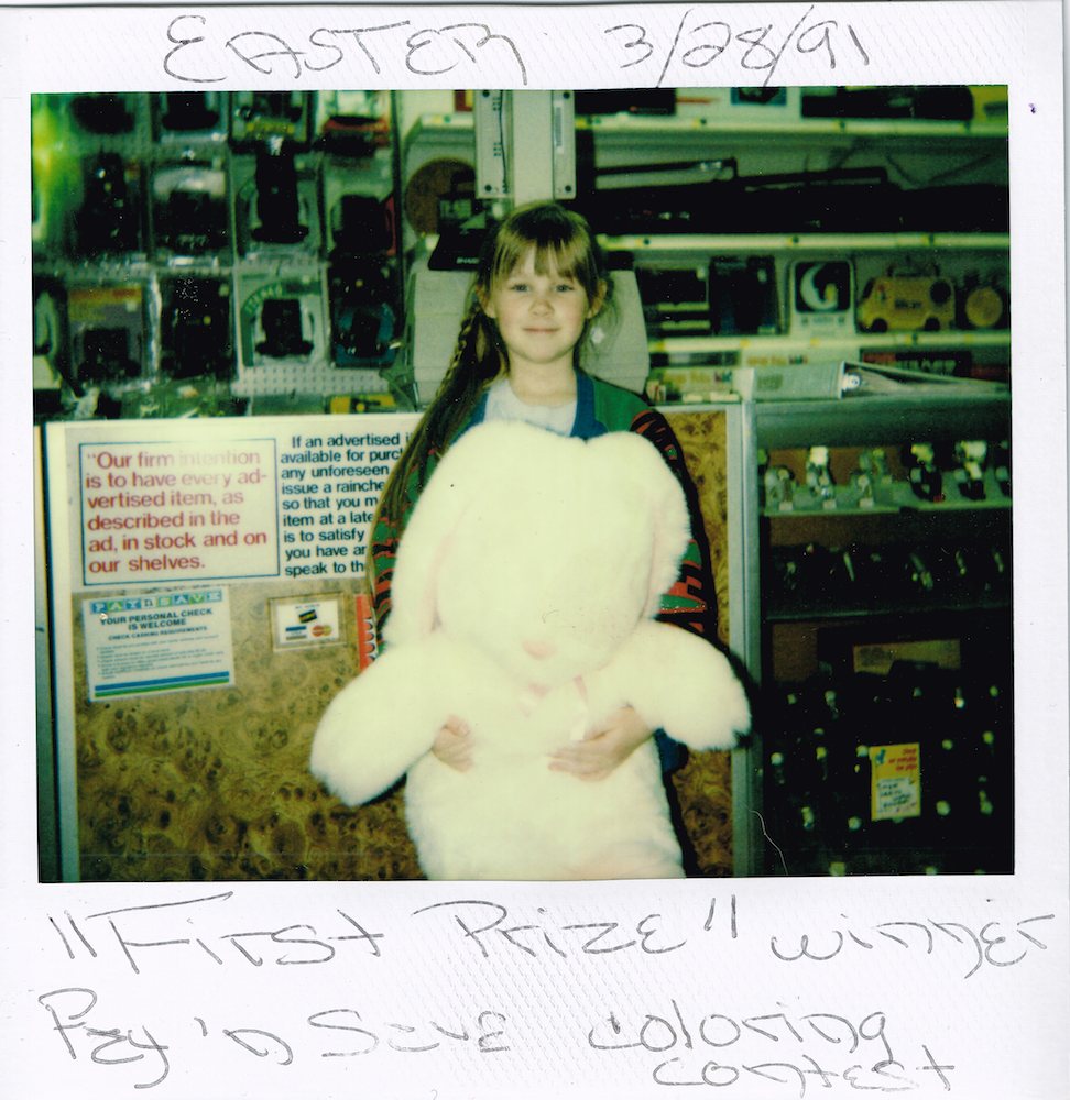 kid holding stuffed animal rabbit 