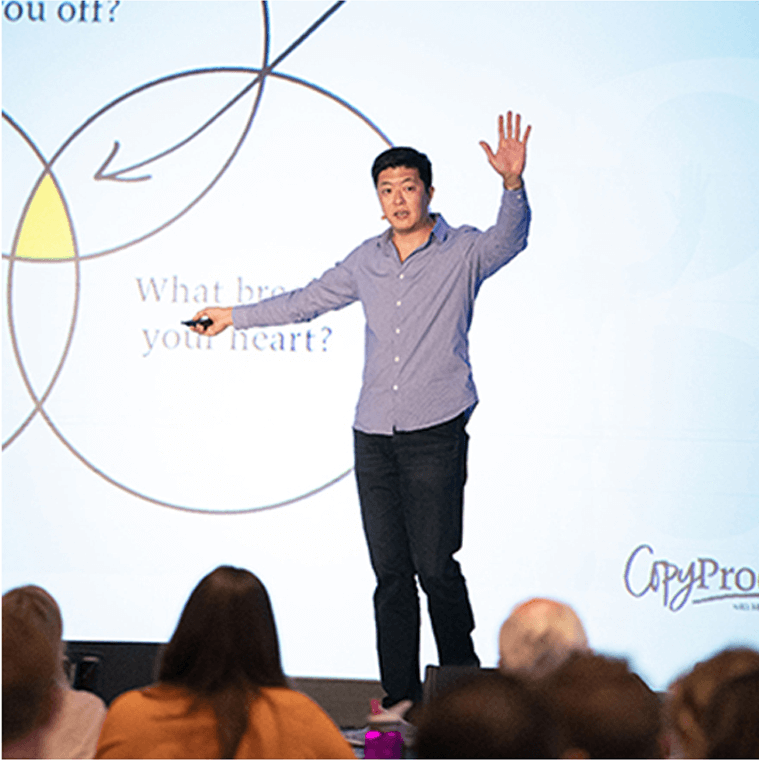 Mike Kim speaking on stage