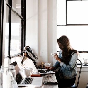 female entrepreneur at work with laptop