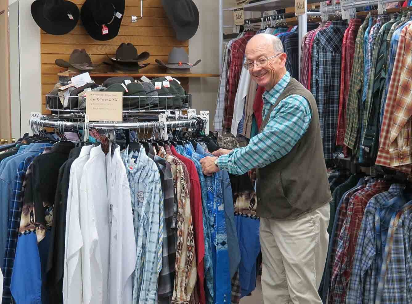 Store Owner Checking the Men's Clothes
